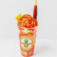 Mangonada · Mango ice cream with bites of mango covered in chamoy, topped with salsaghettis and tamarind...