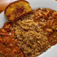 Combo Etouffee · Rich, homemade roux-based sauce served around our signature dirty rice