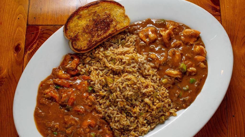 Combo Etouffee · Rich, homemade roux-based sauce served around our signature dirty rice