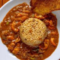 Crawfish Etouffee · Rich, homemade roux-based sauce served around our signature dirty rice