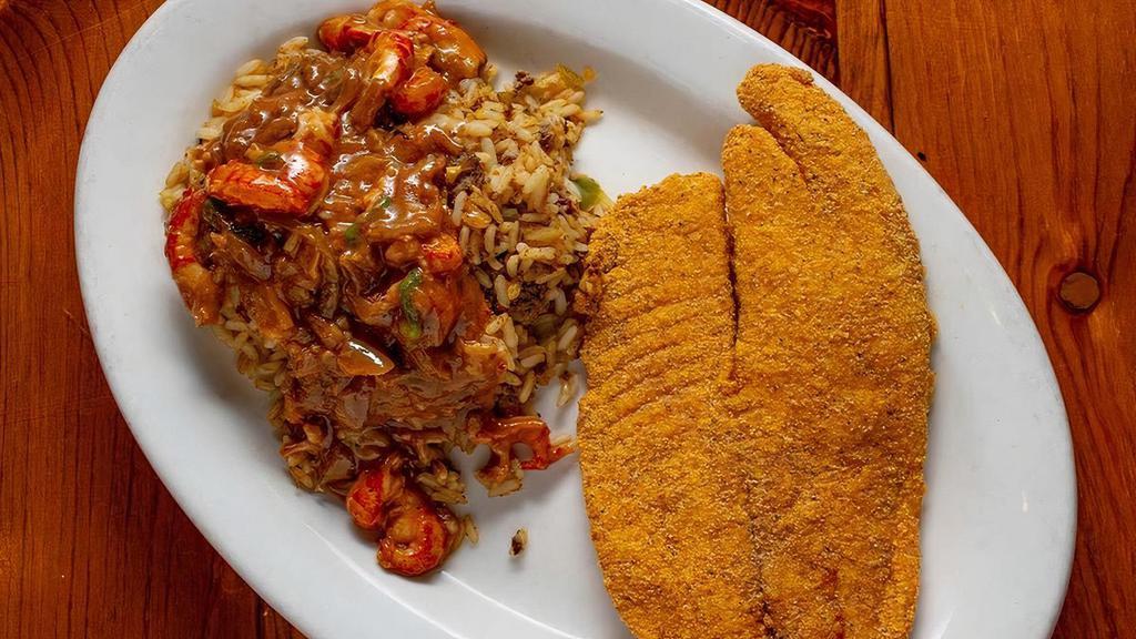 Fried Tilapia & Etouffee · Crispy tilapia fillet fried in our seasoned cornmeal and served with a generous helping of etouffee over our signature dirty rice