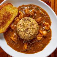 Shrimp Etouffee · Rich, homemade roux-based sauce served around our signature dirty rice