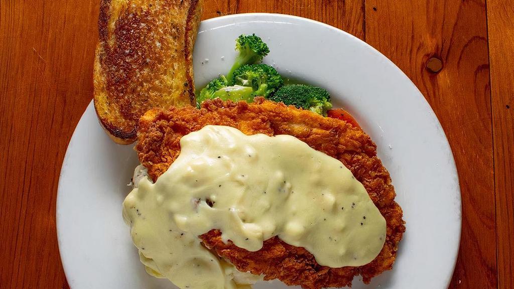 Chicken Fried Chicken · Hand breaded fried chicken breast served with choice of two sides
