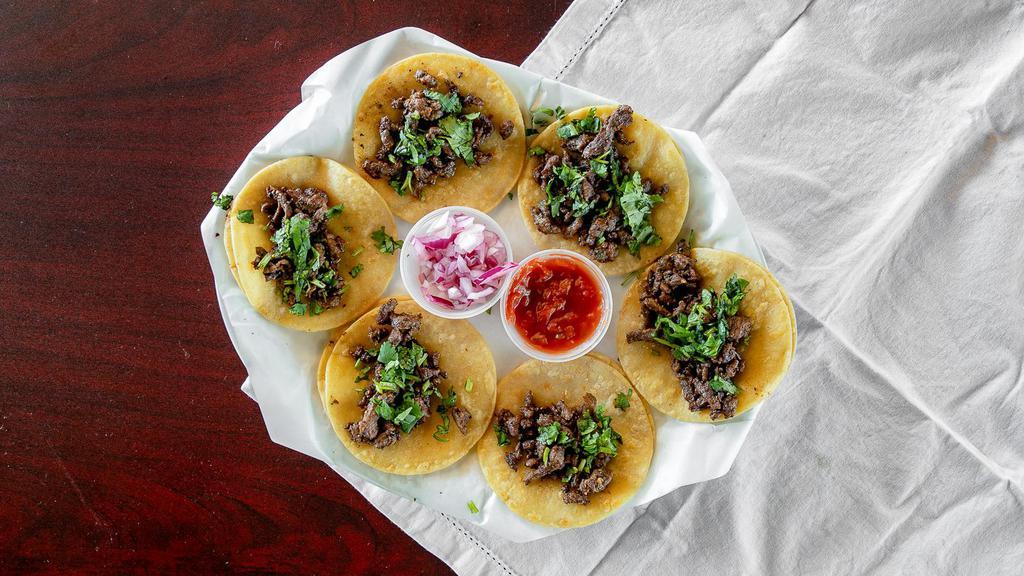 Street Tacos (6 Pcs.) · Steak street tacos Cilantro & Onions with a side of Salsa