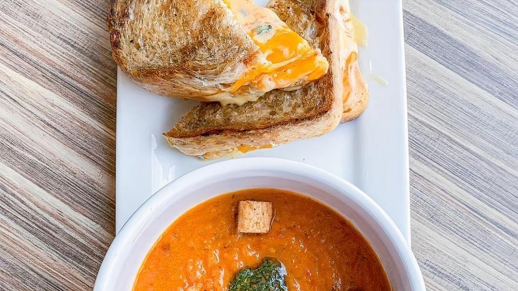 Bowl Roasted Tomato Soup · Garnished with house made walnut pesto and croutons. Vegan. Add a 3-cheese grilled cheese sandwich for $7