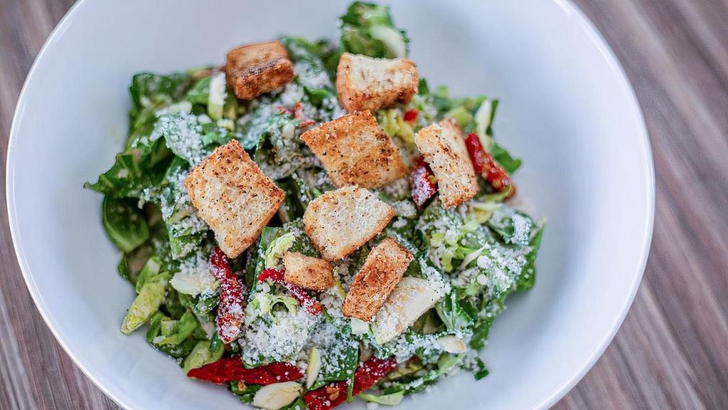 Caesar · Romaine lettuce and sun-dried tomatoes with our house made caesar dressing. Topped with parmesan cheese and homemade garlic herb croutons