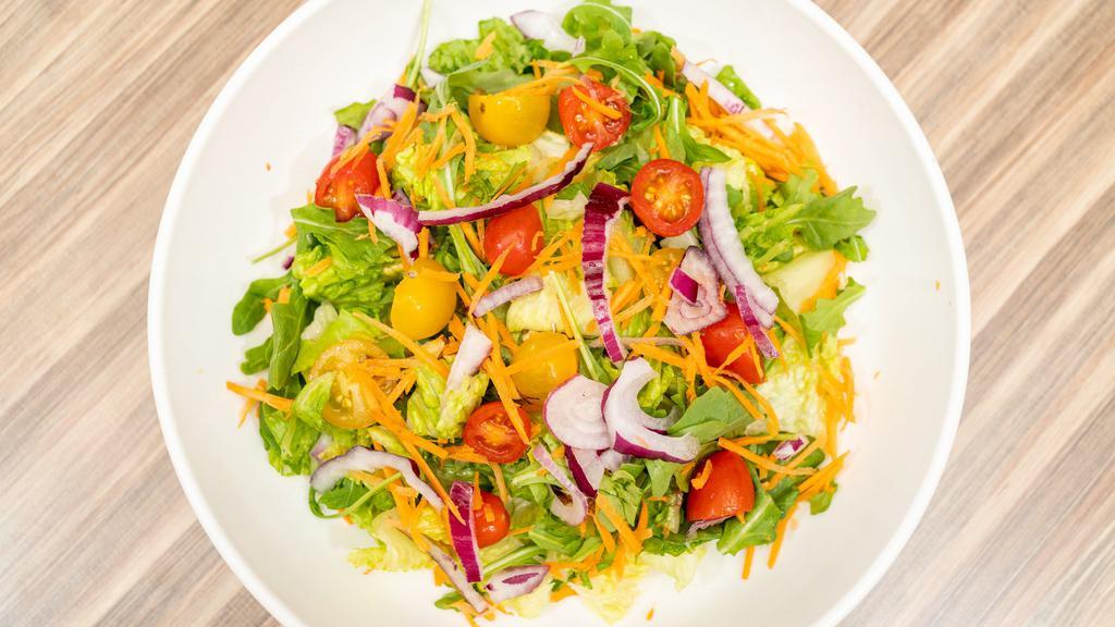 House Salad · Romaine lettuce with carrots, heirloom cherry tomatoes, julienned carrots, and red onion with an olive oil and lemon dressing. Vegan