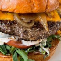 Wagyu Burger · Akaushi beef, caramelized onions, arugula, tomatoes, pickles and homemade burger sauce with ...
