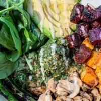 Quinoa Bowl · Cilantro and green pea quinoa topped with avocado, mushrooms, turmeric sweet potatoes, roast...