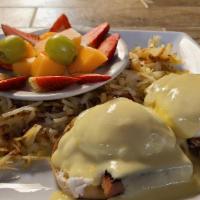 Eggs Benedict · 2 poached eggs, 2 hunks of ham, and hollandaise sauce served on a split and toasted English ...
