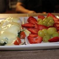 Florentine Benedict · 2 poached eggs on a toasted English muffin, topped with sautéed spinach, diced tomatoes, and...