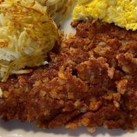 Corned Beef Hash · A hearty portion of Corned beef hash, 2 eggs, choice of side, and toast