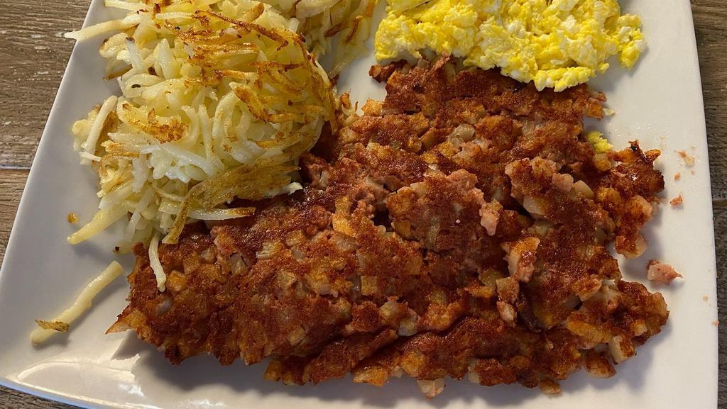 Corned Beef Hash · A hearty portion of Corned beef hash, 2 eggs, choice of side, and toast