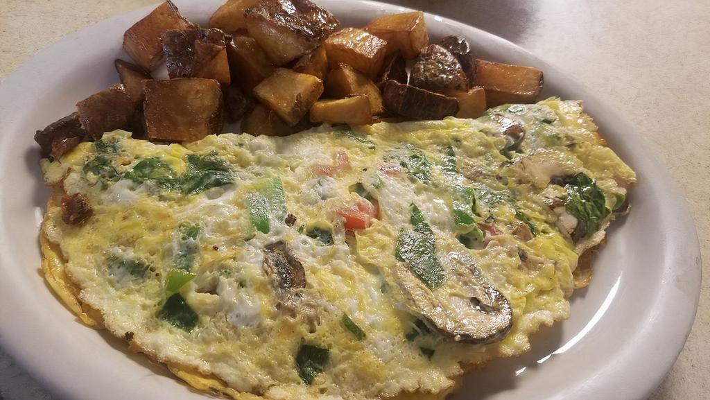 Veg-Out Omelette · Tomatoes, bell peppers, mushrooms, spinach.  with choice of side, and toast