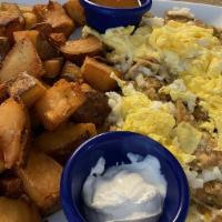 Chilaquiles · Vegetarian. Corn tortillas cooked in our house salsa, topped with cheese and 2 eggs -vegetar...