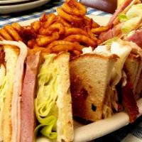 Club Sandwich · Turkey, ham, bacon, lettuce, tomato, american/swiss cheese and mayonnaise. Served with choic...