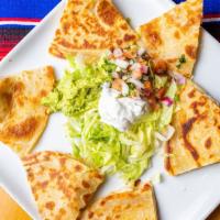 Quesadillas · Delicious, grilled, hand made flour tortilla filled with Monterrey jack cheese and your choi...