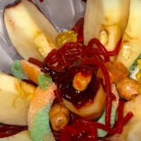 #12 Manzana Loca · Vegetarian. Apple covered in tamarind then sliced and served with gummies and peanuts. Toppe...