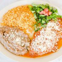 Chile Relleno · Poblano pepper stuffed with cheese, picadillo, or shredded chicken, topped with salsa ranche...