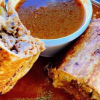 Birriadito · Grilled Birria burrito stuffed with rice, beans, Birria (Guadalajara-style beef), onions, ci...