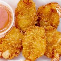Coconut Shrimp · Six to seven pieces shrimps dipped in batter and rolled in shredded crunchy coconut, deep fr...
