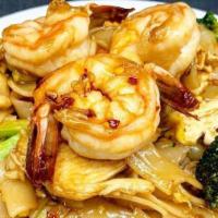 Pad See Yui · Flat rice noodles stir fried with egg, broccoli, carrot, with sweet black house sauce and ch...