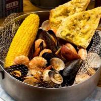 The Steamer Steampot · Mussels, clams, shrimp, garlic seasoning, with garlic bread.