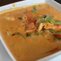 Panang Curry · Panang curry paste, coconut milk, bell peppers, and basil leaves