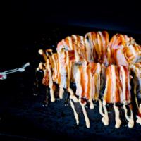 Shaggy Dog (8 Pieces) · Shrimp tempura  topped with crabmeat, spicy mayo, and eel sauce.