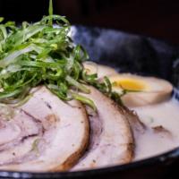 Tonkotsu Ramen · Pork bone broth, char siu, bamboo, soft boiled egg, garlic, green onion, red ginger, sesame.