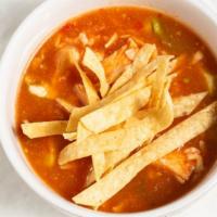 Tortilla Soup Cup · A delicious traditional tortilla soup served with chicken cheese fresh avocado slices and to...