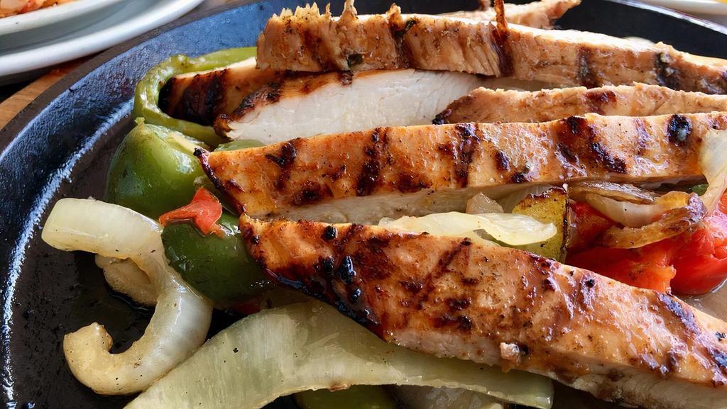 Chicken Fajitas For 2 · Marinated chicken fajita with sautéed onions and bell peppers.