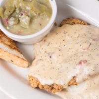 Chicken Fried Steak · Smothered in cream gravy & served with mashed taters & slow cooked green beans.