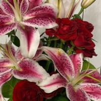 Sweet And Lovely  · Scented stargazer with red spray roses in budvase