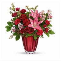 Romantic  Radiance · This arrangement includes red roses, dark pink spray roses, light pink alstroemeria, hot pin...