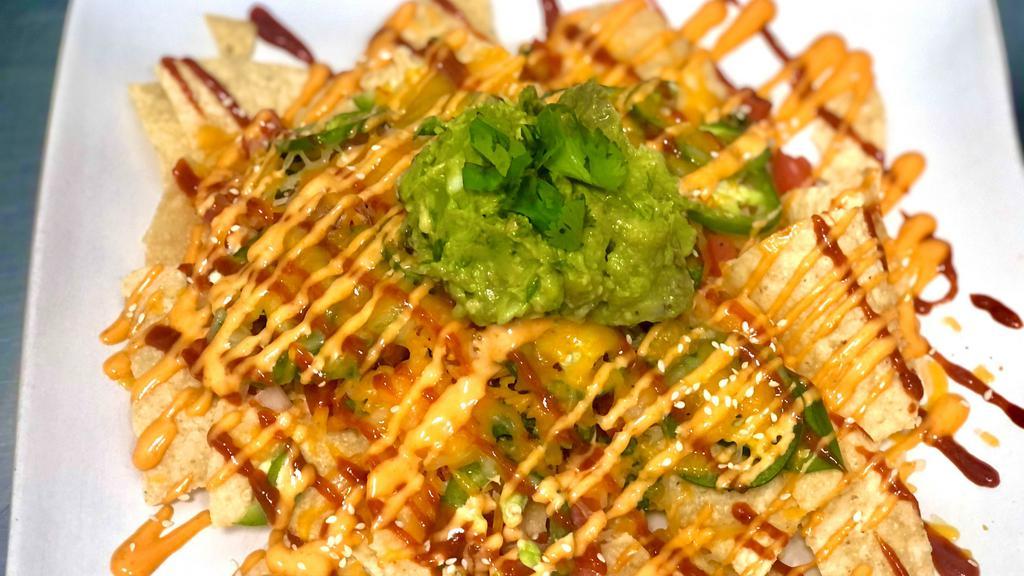 Mini Nachos · Tortilla chips topped with kimchi, pico de gallo, Jalapeños, melted shredded Cheddar & Monterey Jack cheese, Guacamole and drizzled with Gochujang & Spicy mayo.