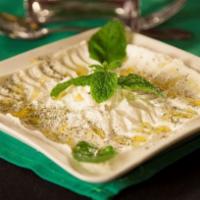Labneh · Thick yogurt mixed with fresh garlic topped with olive oil, served with pita.