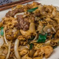 Kwetiau Goreng · Flat rice noodles stir fried with shrimp chicken and beef.