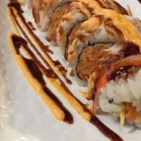 Grizzly Roll (10 Pcs) · Shrimp tempura, spicy crab meat inside, crab meat on top with spicy mayo and eel sauce.