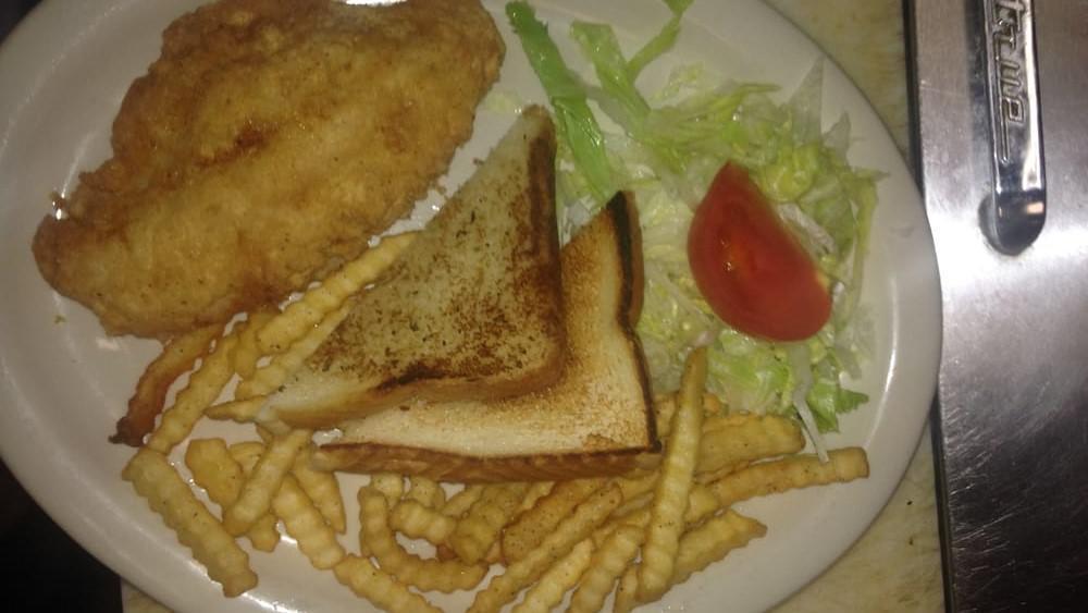 Catfish Platter · Hand-breaded catfish with jalapeño and lime tartar sauce. Served with garlic bread and your choice of French fries or coleslaw.