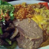 Las Chiladas Plate · Two cheese enchiladas with gravy, fajitas (beef or chicken), and guacamole salad.