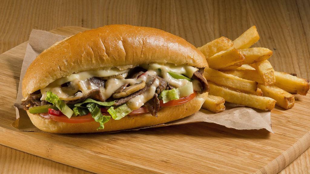 Steak & Onion Cheesesteak · A classic cheesesteak. Juicy, tender, chopped sirloin steak, grilled onions, melted provolone cheese, banana peppers, loaded on a buttered, toasted, sesame seed bun.