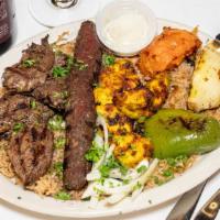 Mixed Grill · A combination of shish Tawook, shish kabob, and kafta. Served with grilled vegetables, rice,...