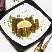 Grape Leaves · 6 pieces with meat and rice.