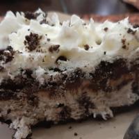 Cookies & Cream Ice Cream Pie · A thick slab of Sweet Cream & Cookies ice cream on an Oreo’s Crust covered with a layer of o...