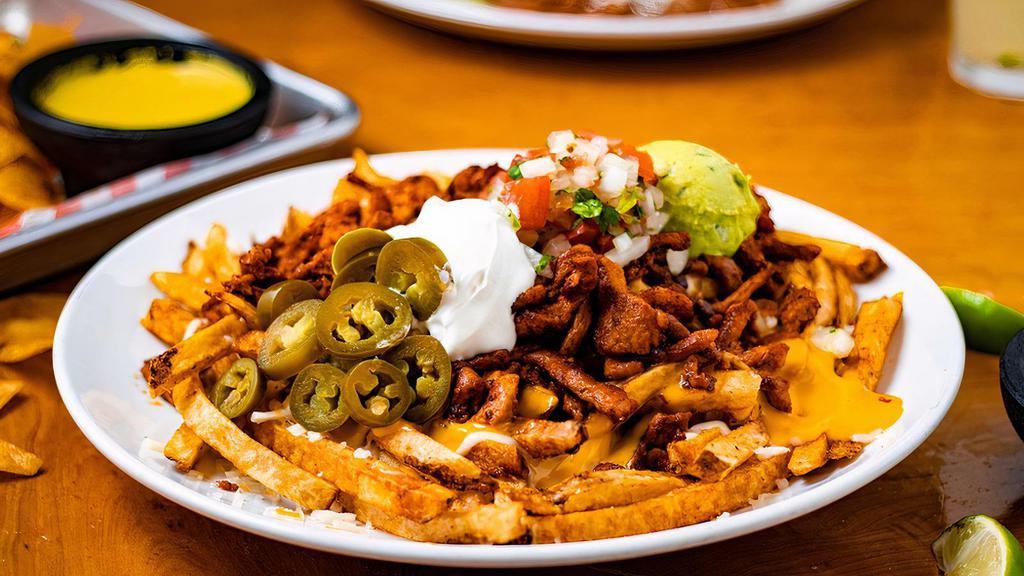 Loaded Fries · French fries with your meat of choice, queso, pico, guacamole, sour cream and jalapeños.