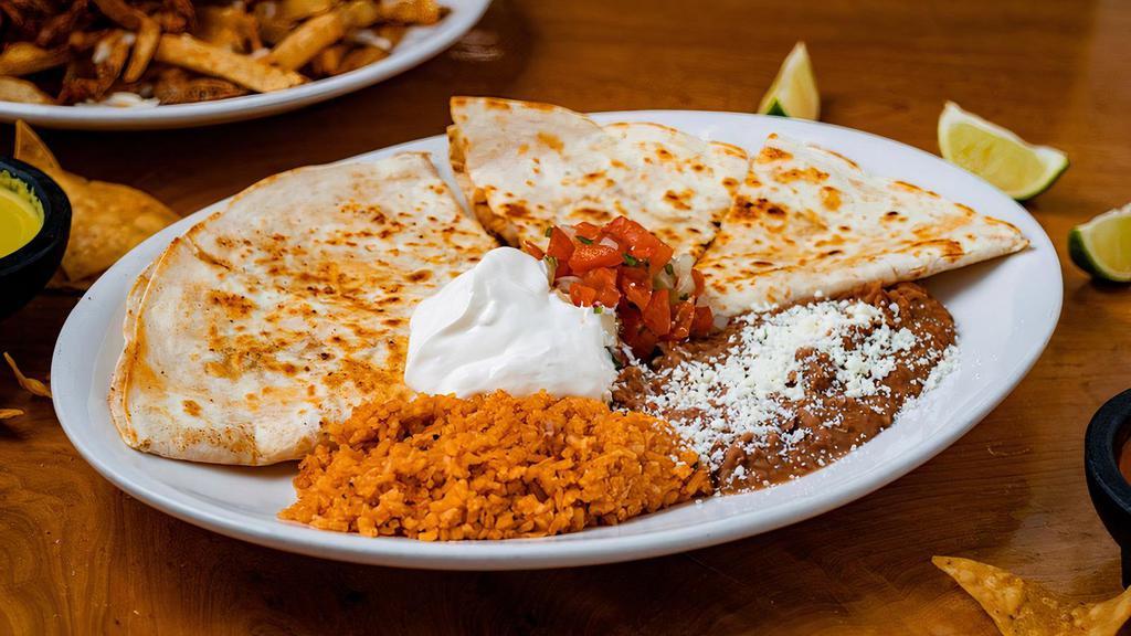 Quesadillas · Your choice of cheese or meat, with pico, sour cream, with a side of rice and refried beans.