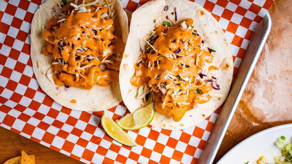 Fish Tacos · Served with corn or flour tortilla and topped with homemade coleslaw and chipotle sauce