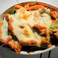 Baked Ziti · Homemade zidi pasta, multi-layered with fresh mozzarella, riccota cheese and vegeterian chun...
