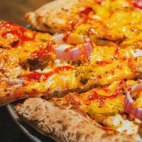 Southwestern Pizza · Cheddar, mozzarella cheese, BBQ marinated chicken breast, red onion, and jalapeno peppers.